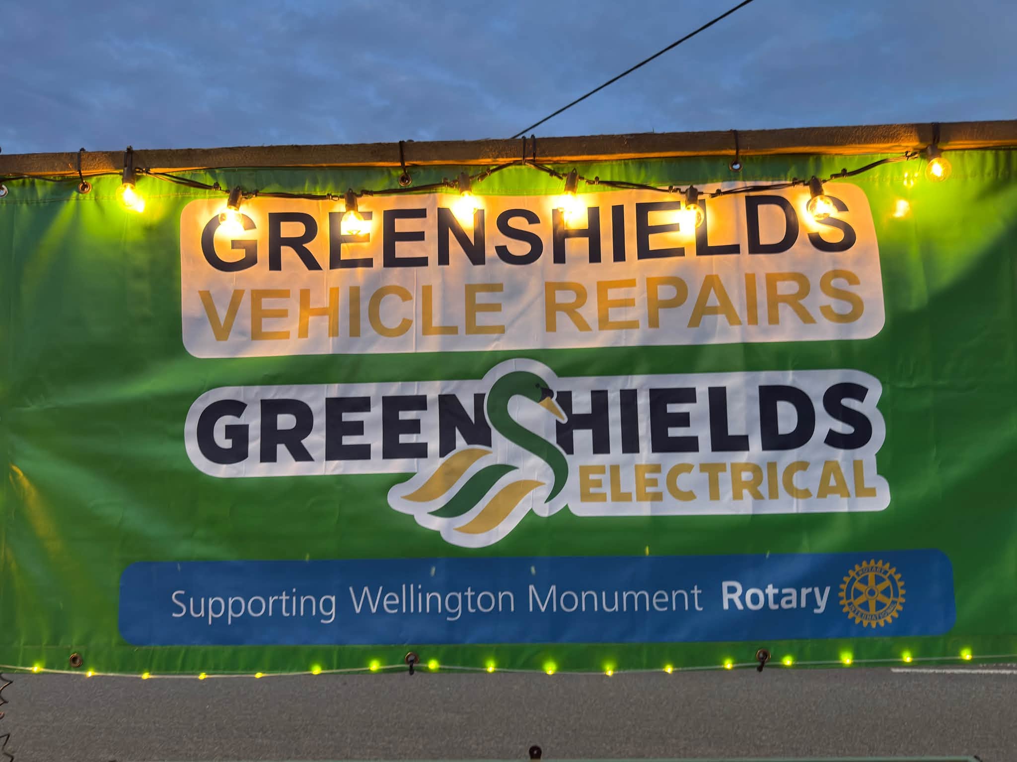 The lit Greenshields banner reading Supporting Wellington Monument Rotary