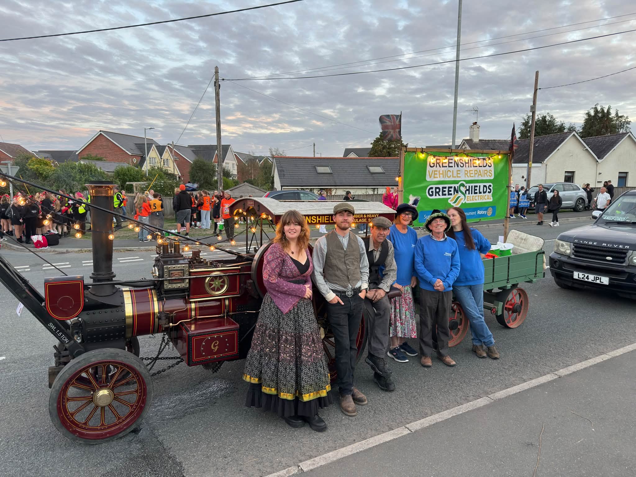 The team in costume with the steam engine on a Wellington street
